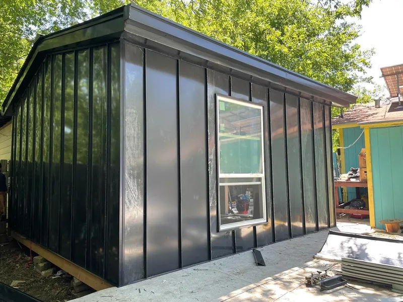 Black standing seam metal wall panels for Metal Roof Installation in Flowood